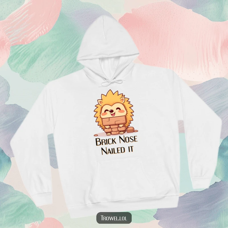 Funny hedgehog hoodie showing a cheerful animal expertly balancing a brick on its nose, designed for comfort and amusement.