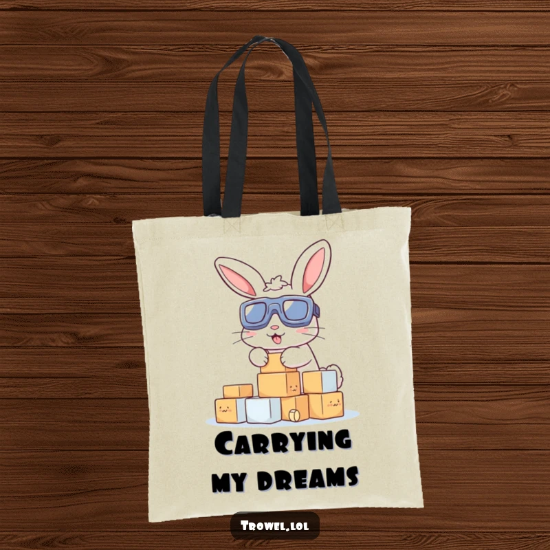 Funny tote bag showing a bunny with goggles stacking small blocks, symbolizing productivity, humor, and carrying capacity.